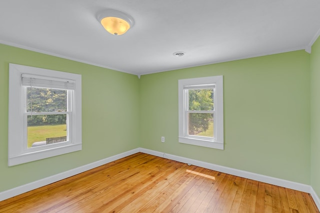 19 Wharton Grove Ln, Weems, VA 22576 - unfurnished room with crown molding and hardwood / wood-style floors