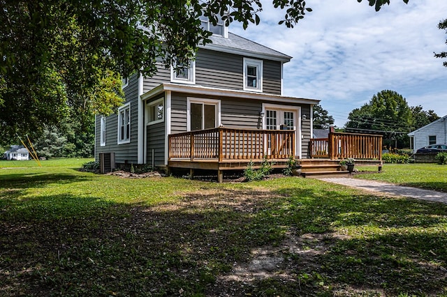 19 Wharton Grove Ln, Weems, VA 22576 - traditional style home featuring a front yard and a deck