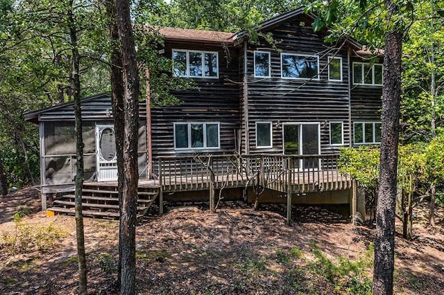 912 Levelgreen Rd, Lancaster, VA 22503 - rear view of property featuring a wooden deck and a sunroom