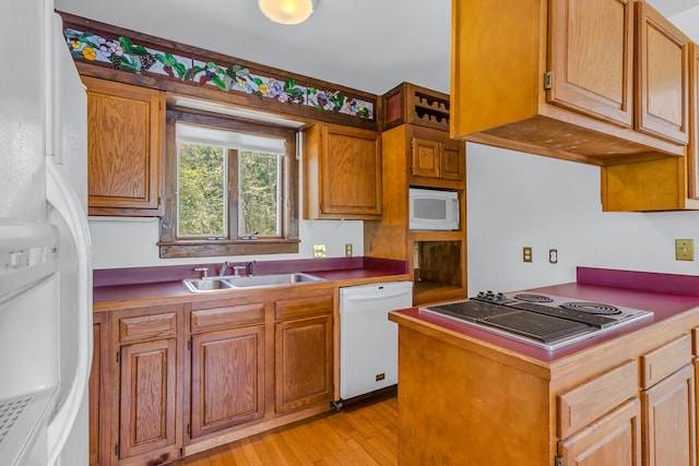 912 Levelgreen Rd, Lancaster, VA 22503 - kitchen with white appliances, light wood finished floors, and brown cabinets