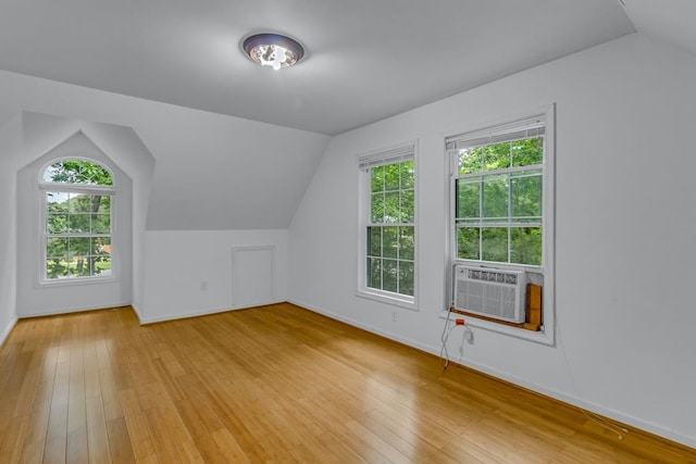 1 Bull Creek Dr, Lancaster, VA 22503 - additional living space with vaulted ceiling, baseboards, light wood finished floors, and cooling unit