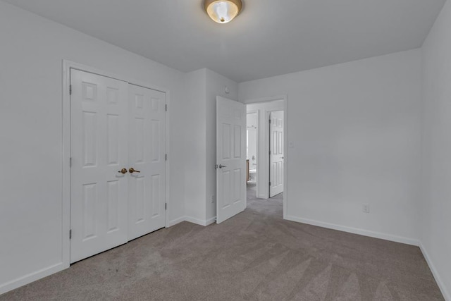 1 Bull Creek Dr, Lancaster, VA 22503 - unfurnished bedroom with carpet flooring, baseboards, and a closet