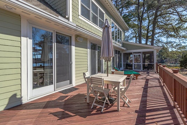 wooden terrace featuring a sunroom