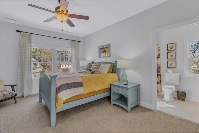 bedroom with multiple windows, carpet flooring, and visible vents