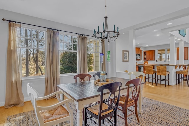 dining room featuring a chandelier, light wood finished floors, and recessed lighting