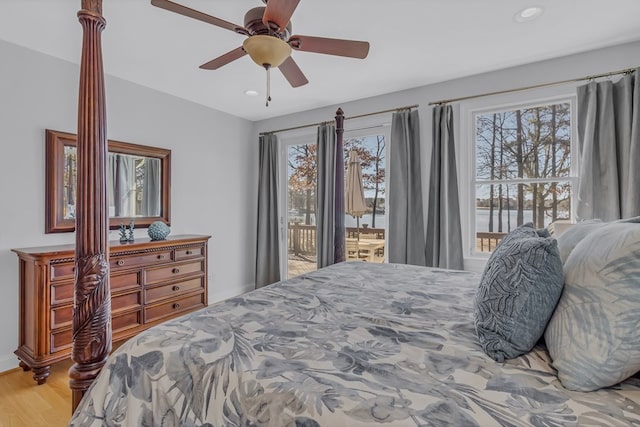 bedroom with access to outside, ceiling fan, wood finished floors, and recessed lighting