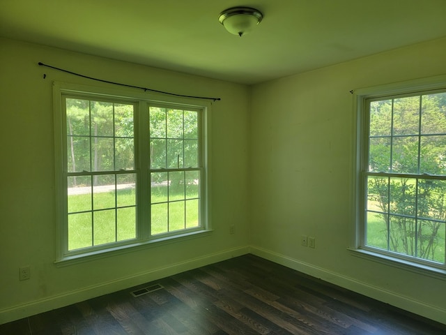 31 Moccasin Trl, Weems, VA 22576 - unfurnished room featuring dark wood-type flooring