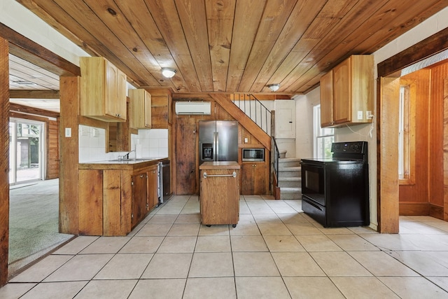 63 Pioneer Trl, Hague, VA 22469 - kitchen with appliances with stainless steel finishes, a wall mounted AC, wooden ceiling, a center island, and light tile patterned floors