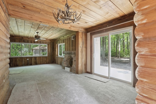 63 Pioneer Trl, Hague, VA 22469 - unfurnished living room with wooden ceiling, carpet, a chandelier, and a ceiling fan