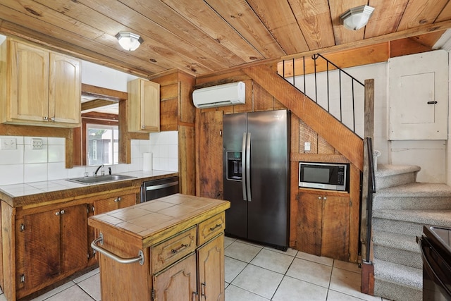 63 Pioneer Trl, Hague, VA 22469 - kitchen featuring stainless steel appliances, tile countertops, wooden ceiling, a wall mounted AC, and light tile patterned flooring