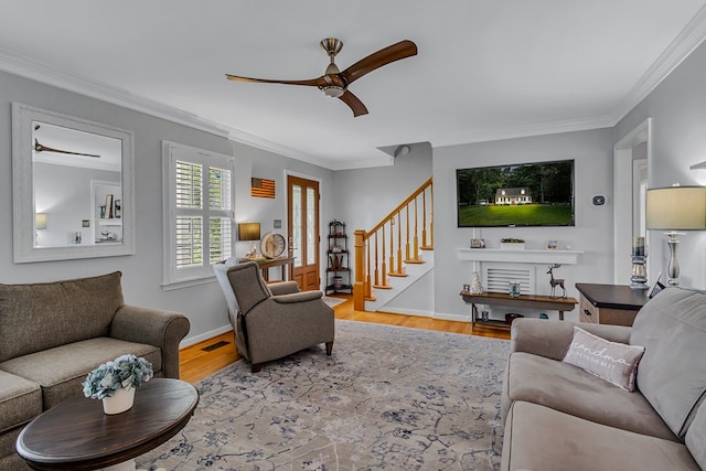 3503 Canal Rd, Farnham, VA 22460 - living room featuring a ceiling fan, wood finished floors, stairs, and crown molding
