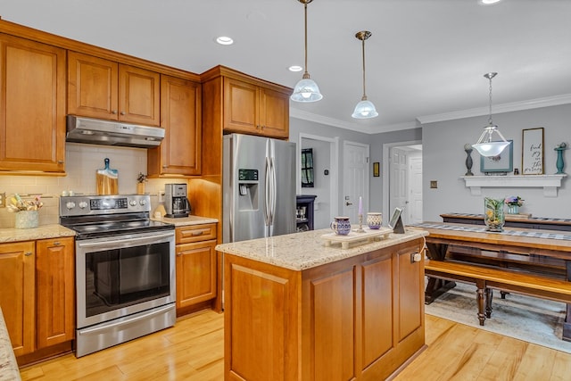 3503 Canal Rd, Farnham, VA 22460 - kitchen featuring appliances with stainless steel finishes, under cabinet range hood, light wood-style floors, brown cabinets, and light stone counters