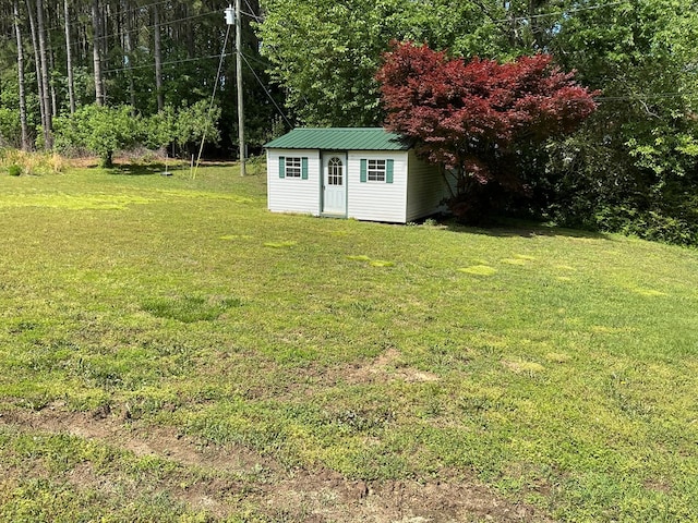 2884 Lake Rd, Lottsburg, VA 22511 - view of green lawn featuring an outbuilding and a shed