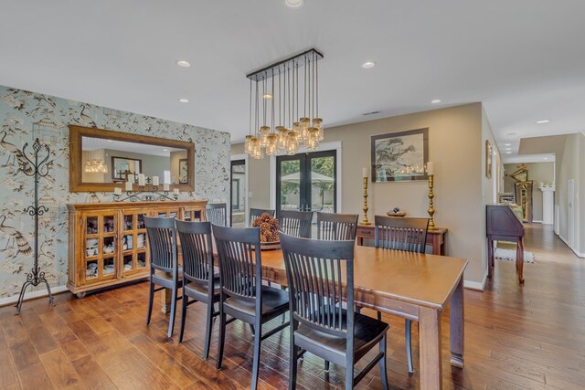 1083 Ottoman Ferry Rd, Lancaster, VA 22503 - dining room with wallpapered walls, baseboards, an accent wall, wood finished floors, and recessed lighting