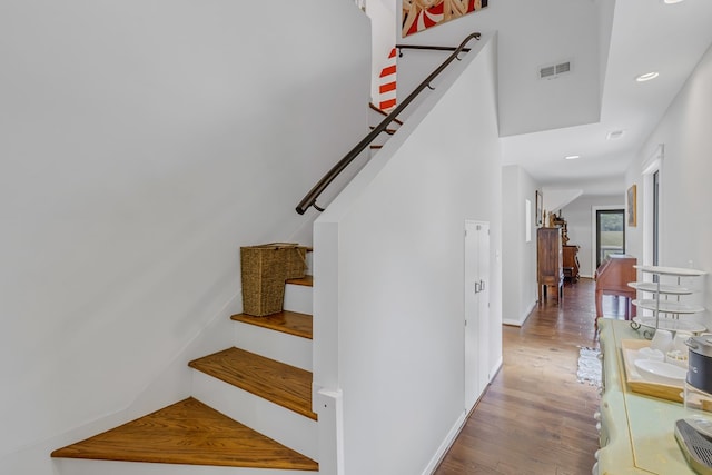 1083 Ottoman Ferry Rd, Lancaster, VA 22503 - staircase featuring wood finished floors, baseboards, and recessed lighting