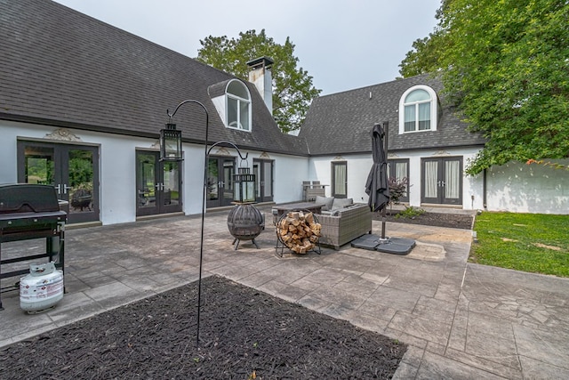 1083 Ottoman Ferry Rd, Lancaster, VA 22503 - back of property featuring french doors, roof with shingles, a patio area, and stucco siding