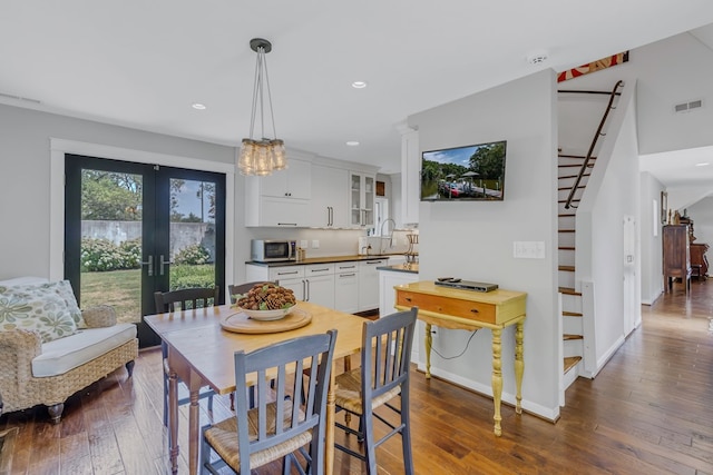 1083 Ottoman Ferry Rd, Lancaster, VA 22503 - dining room featuring dark wood-style floors, recessed lighting, french doors, stairway, and baseboards