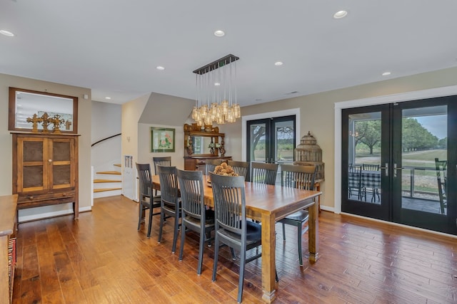1083 Ottoman Ferry Rd, Lancaster, VA 22503 - dining space with french doors, hardwood / wood-style flooring, stairway, recessed lighting, and a chandelier