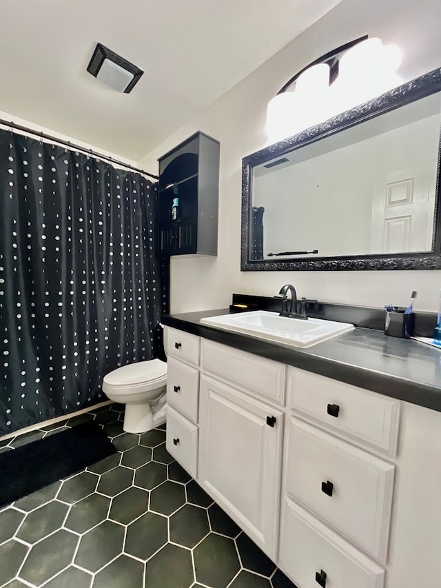 701 Lewis St, Tappahannock, VA 22560 - full bathroom with vanity, tile patterned flooring, and curtained shower