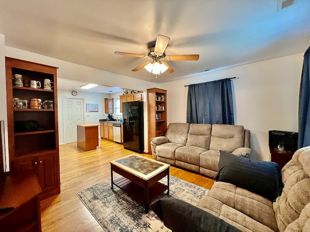 701 Lewis St, Tappahannock, VA 22560 - living area featuring ceiling fan and light wood finished floors