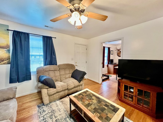 701 Lewis St, Tappahannock, VA 22560 - living room featuring plenty of natural light, ceiling fan, and light wood-type flooring