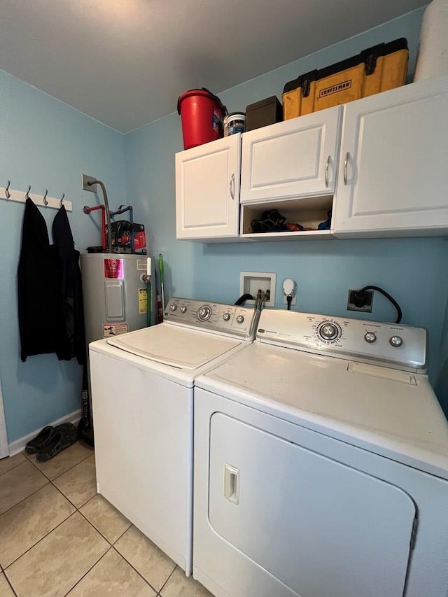 701 Lewis St, Tappahannock, VA 22560 - laundry room featuring cabinet space, independent washer and dryer, light tile patterned flooring, and electric water heater