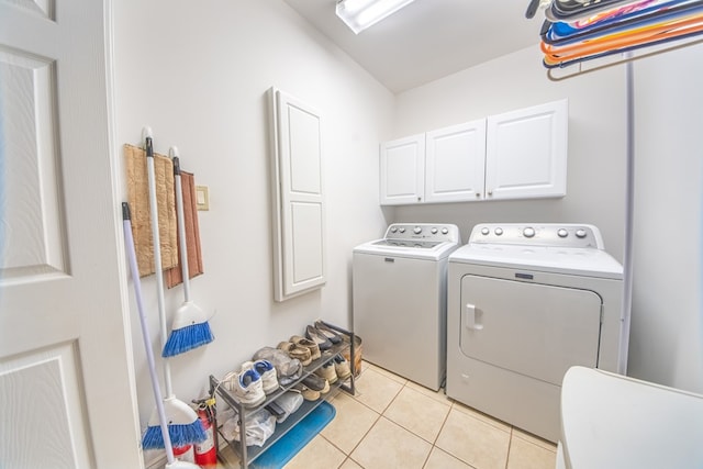 1851 Desha Rd, Tappahannock, VA 22560 - laundry area with separate washer and dryer, light tile patterned flooring, and cabinet space