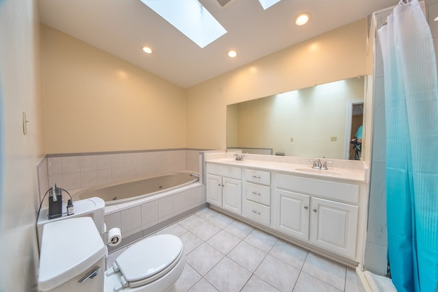 1851 Desha Rd, Tappahannock, VA 22560 - bathroom with toilet, a whirlpool tub, tile patterned floors, a skylight, and double vanity