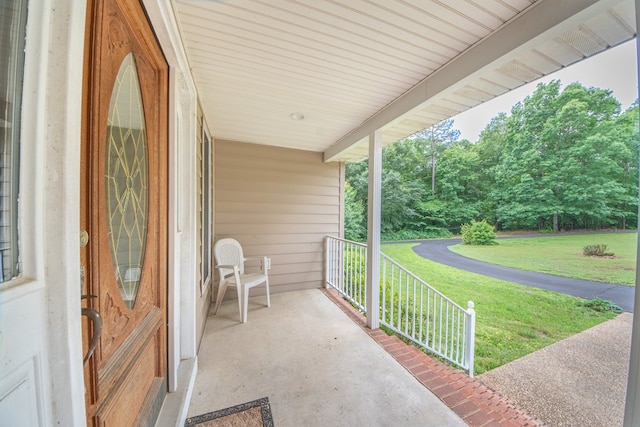1851 Desha Rd, Tappahannock, VA 22560 - porch featuring a yard