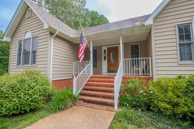 1851 Desha Rd, Tappahannock, VA 22560 - doorway to property featuring a porch and roof with shingles