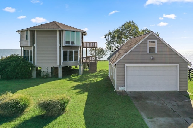 exterior space featuring a yard and a detached garage