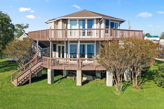 back of property featuring a yard, french doors, stairway, and a wooden deck