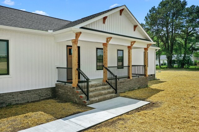 2976 Newmans Neck Rd, Heathsville, VA 22473 - property entrance with a shingled roof, covered porch, and crawl space
