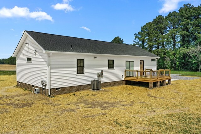 2976 Newmans Neck Rd, Heathsville, VA 22473 - back of house featuring crawl space, a wooden deck, roof with shingles, and central AC unit