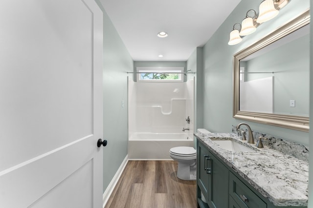 2976 Newmans Neck Rd, Heathsville, VA 22473 - bathroom with wood finished floors, vanity, toilet, baseboards, and  shower combination