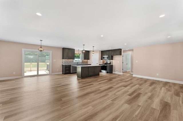 2976 Newmans Neck Rd, Heathsville, VA 22473 - kitchen featuring open floor plan, a center island, healthy amount of natural light, stainless steel appliances, and recessed lighting