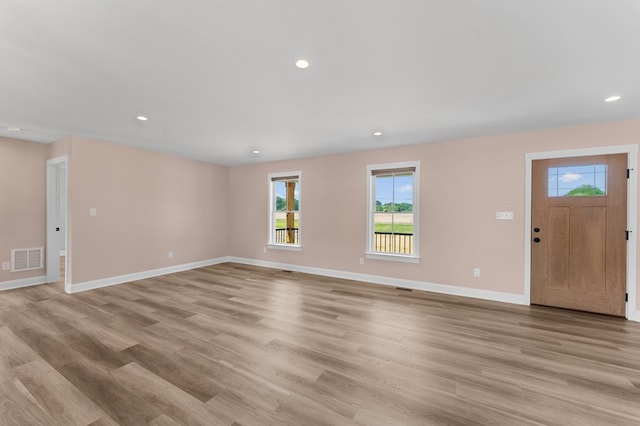 2976 Newmans Neck Rd, Heathsville, VA 22473 - unfurnished living room featuring light wood-type flooring, baseboards, and recessed lighting