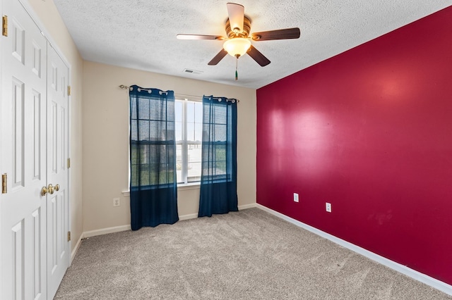 135 Hobbs Hole Ln, Tappahannock, VA 22560 - unfurnished bedroom featuring a textured ceiling, carpet flooring, and ceiling fan