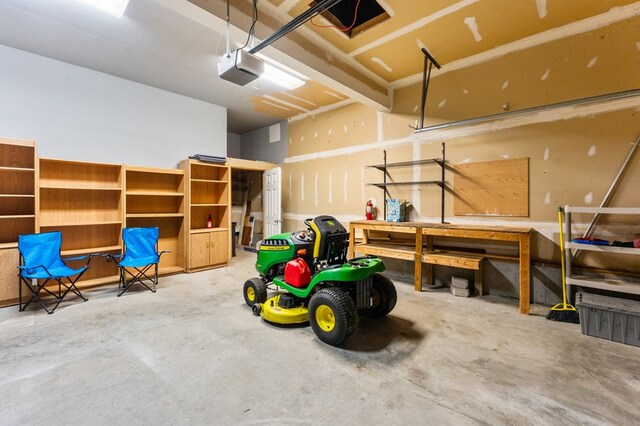 135 Hobbs Hole Ln, Tappahannock, VA 22560 - garage with a garage door opener and a workshop area