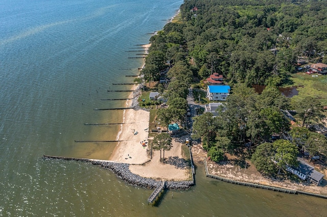aerial view featuring a forest view and a water view