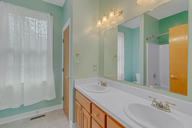 full bathroom featuring shower / bath combination, vanity, and toilet