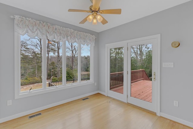 interior space featuring hardwood / wood-style floors and ceiling fan