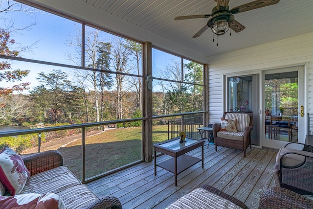 sunroom / solarium with ceiling fan