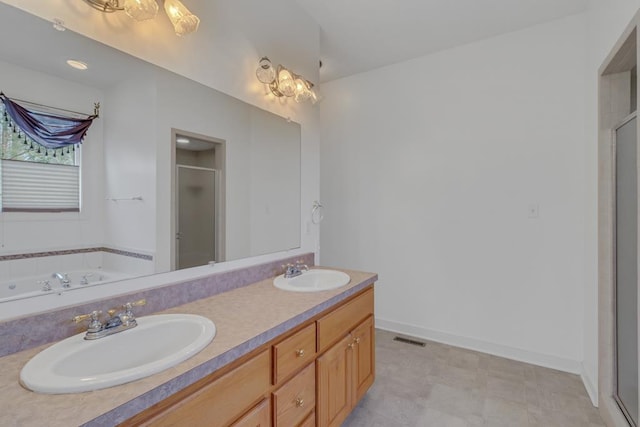 bathroom featuring vanity and separate shower and tub