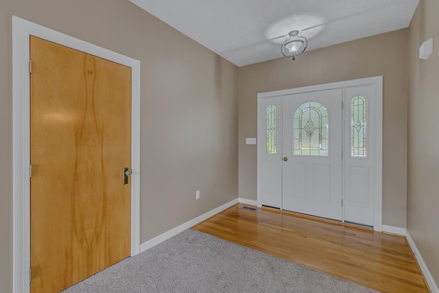 foyer with hardwood / wood-style floors