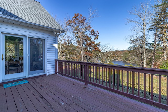 wooden terrace with a water view