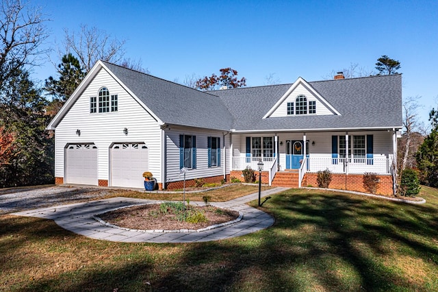 view of front facade featuring a porch, a garage, and a front yard