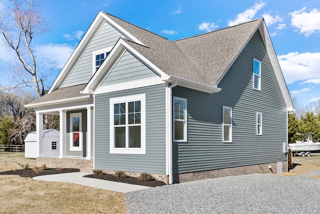 view of front of house featuring roof with shingles