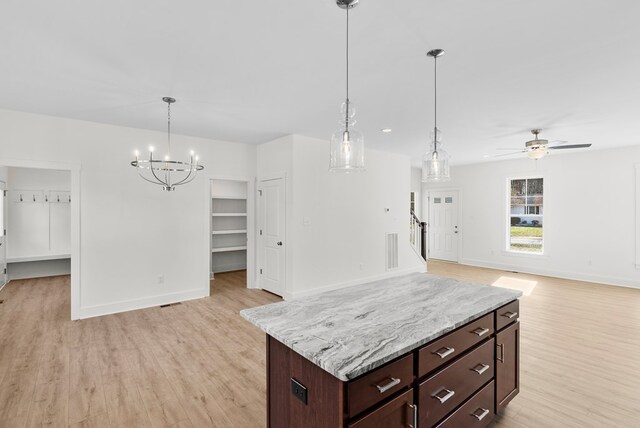 kitchen featuring light stone countertops, stainless steel appliances, sink, light hardwood / wood-style flooring, and white cabinets