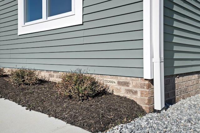 view of home's exterior with crawl space